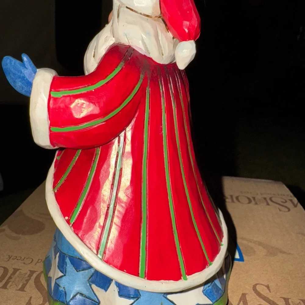 Jim Shore Santa Figurine with Star please look. Closely at pictures